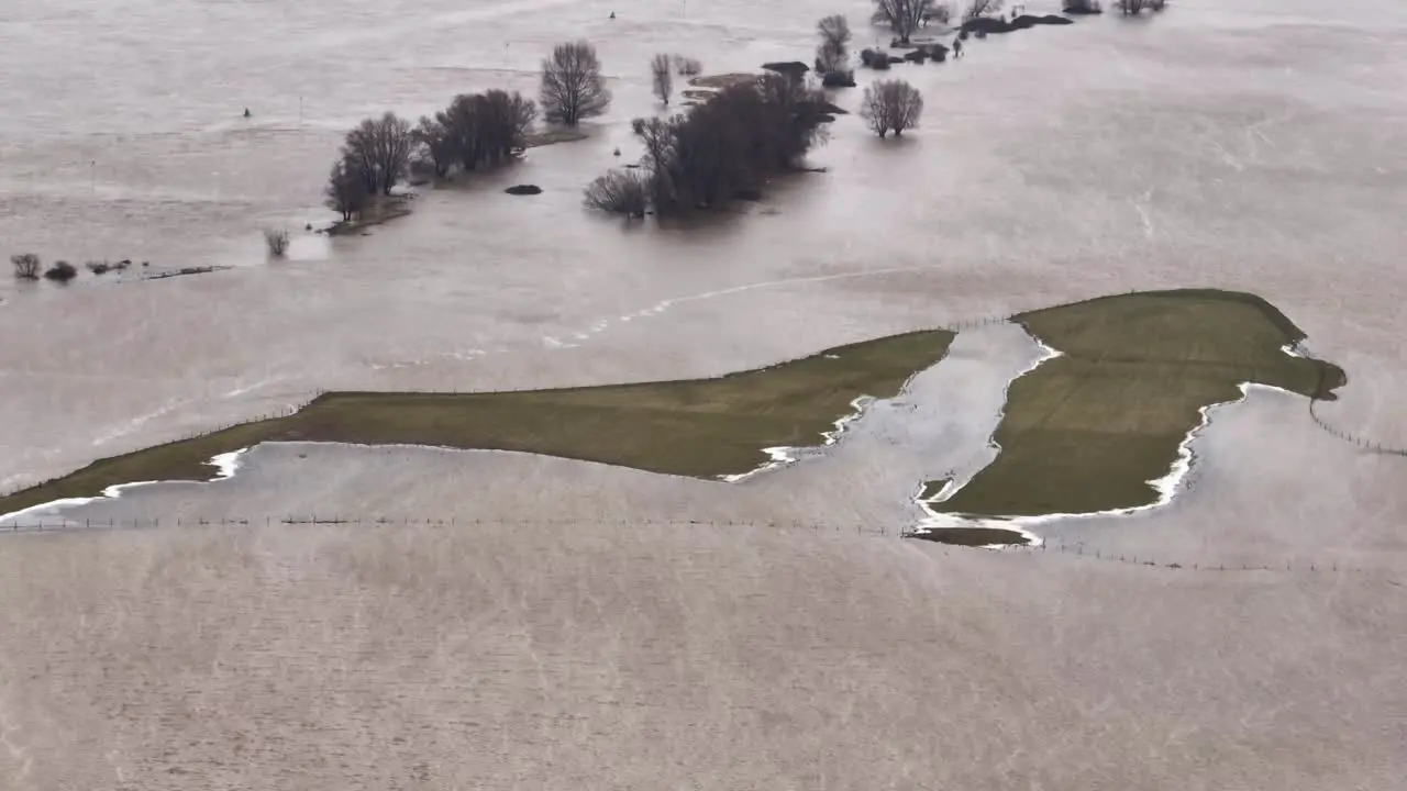 Landscape and farm land heavily flooded around river Waal Woudrichem