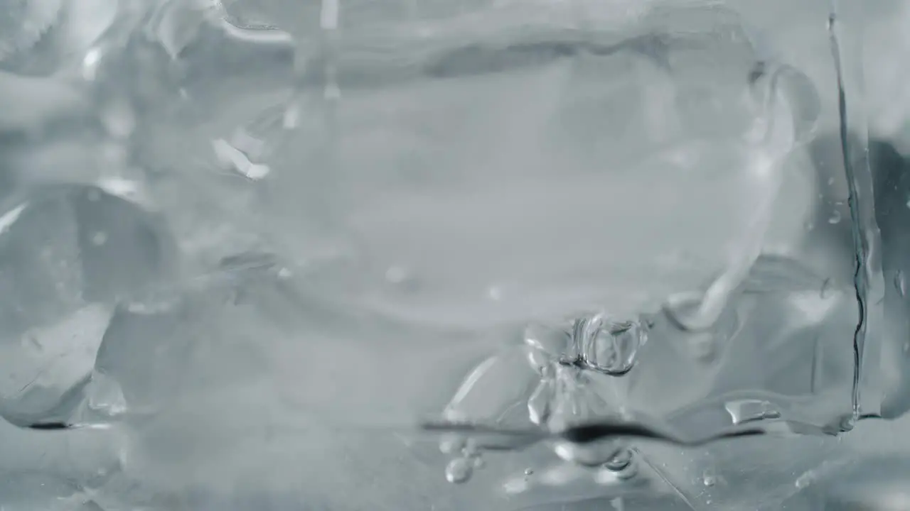 Bubbles Floating in Freezing Ice Water Close-Up