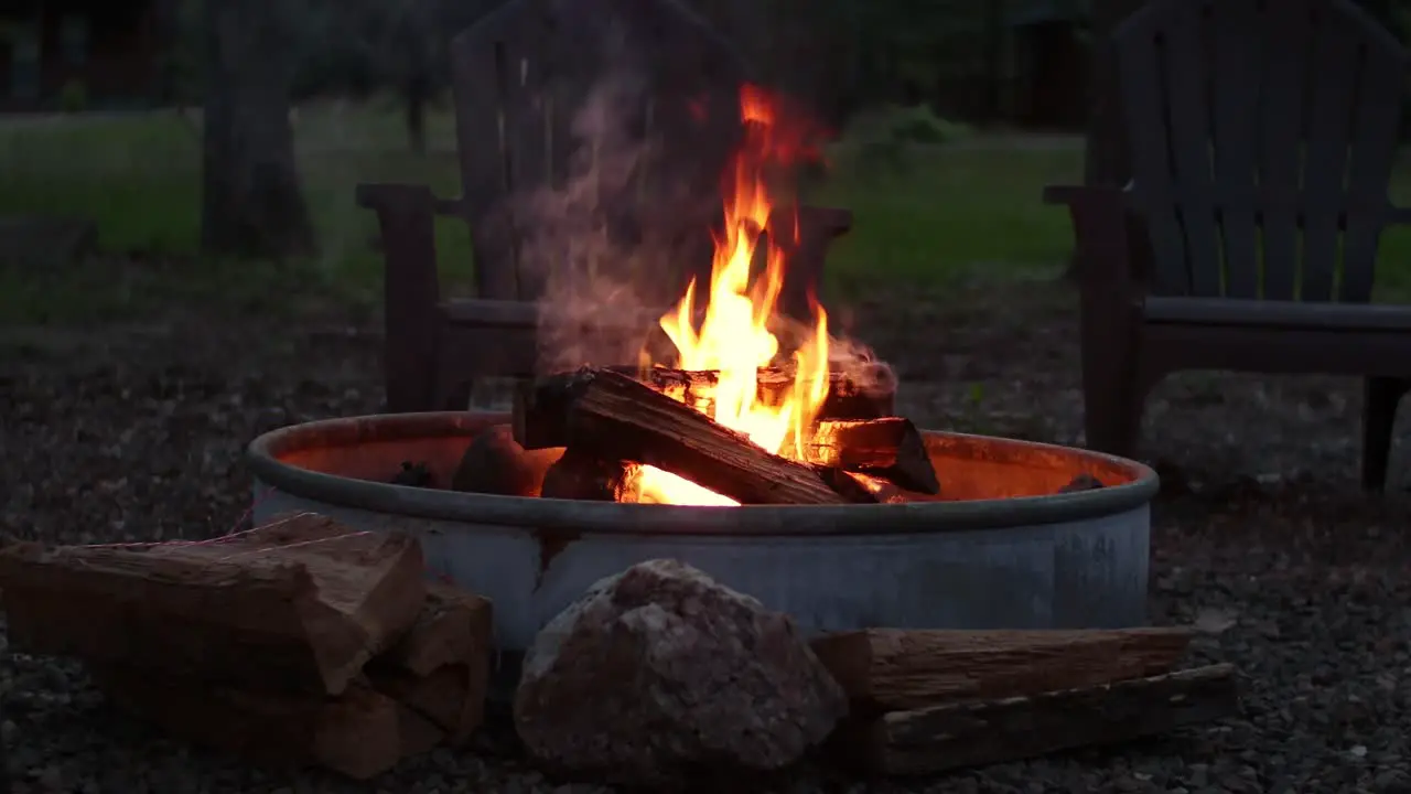 Beautiful 4k footage of a campfire outside in the woods