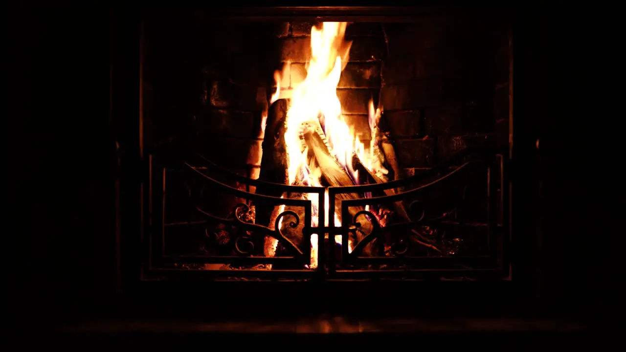 Cozy Fireplace in a dark room of a Cabin in Mountains