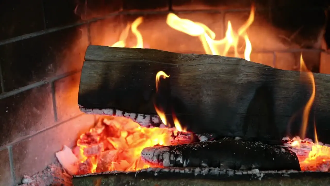 Close Up Of Burning Log And Hot Embers In Slow Motion