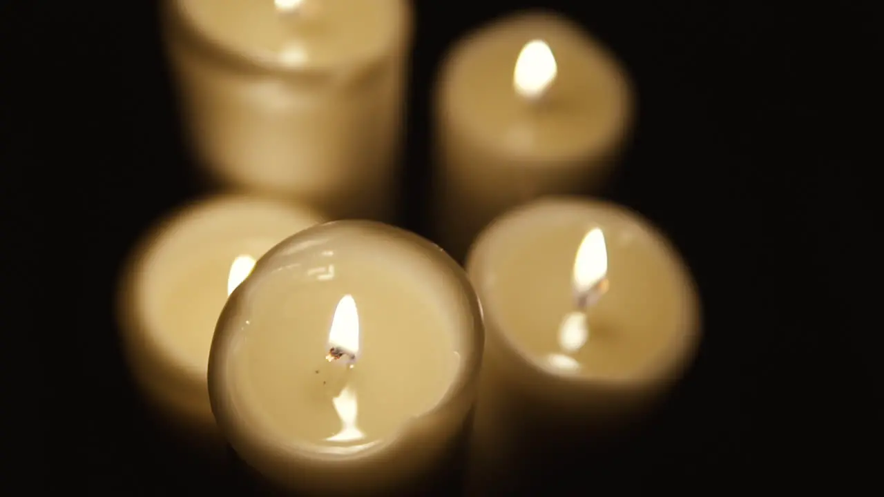 Static shot on top of a lit candle slow motion