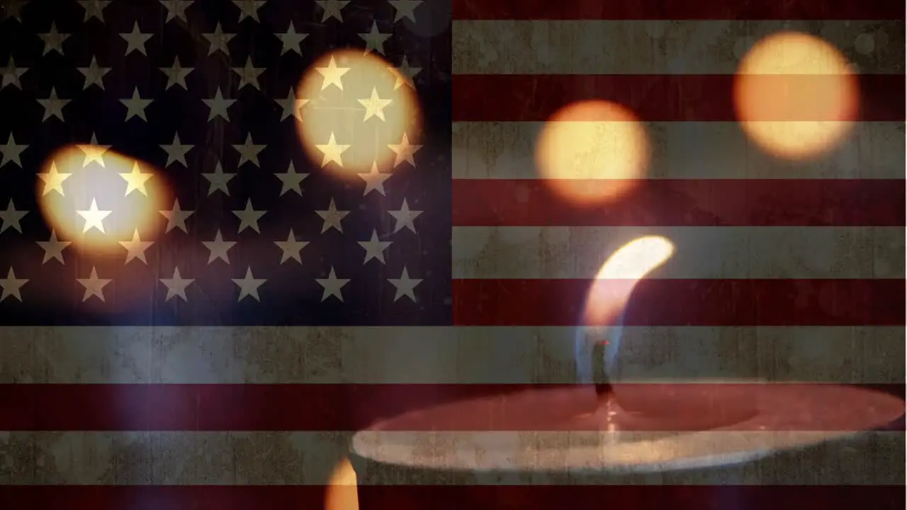 American flag with candles in the background