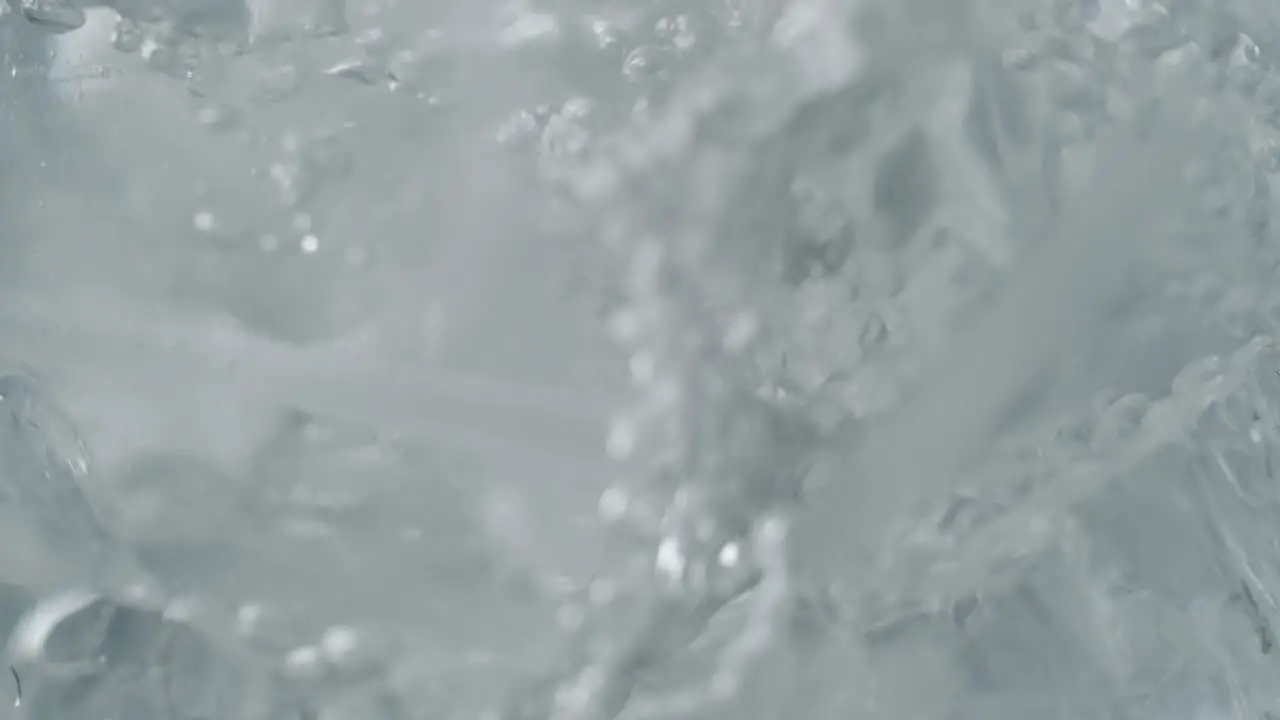 Water Stream Pouring Over Ice Cubes