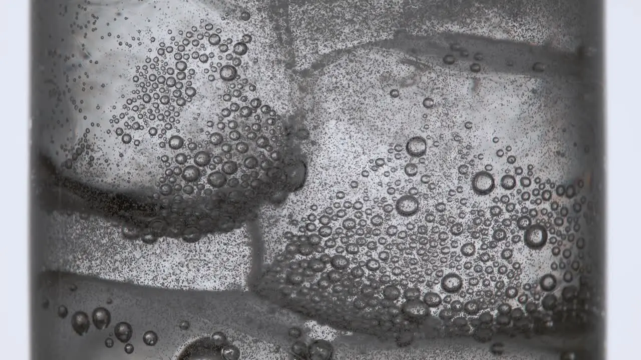 Bubbles Forming in Clear Water in a Glass