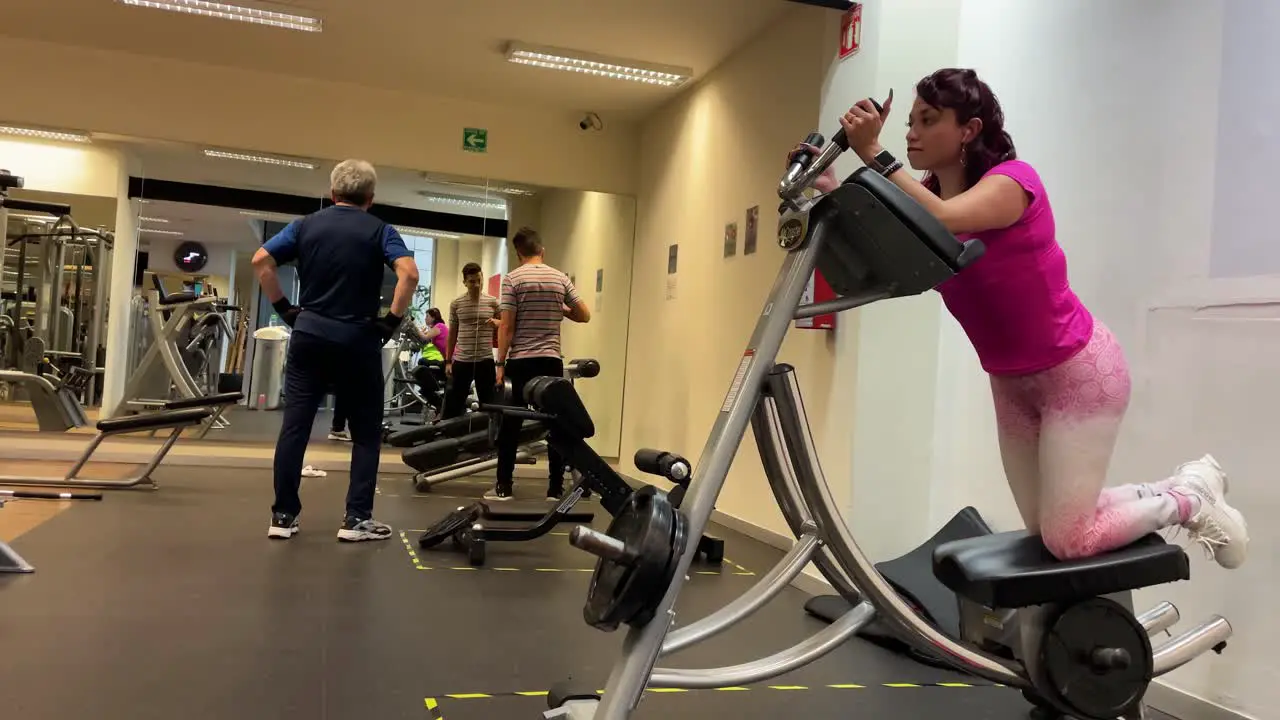 shot of people doing various exercises in a gym in Mexico city downtown