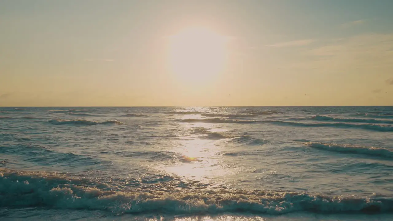 Waves on sea during sunset slow motion