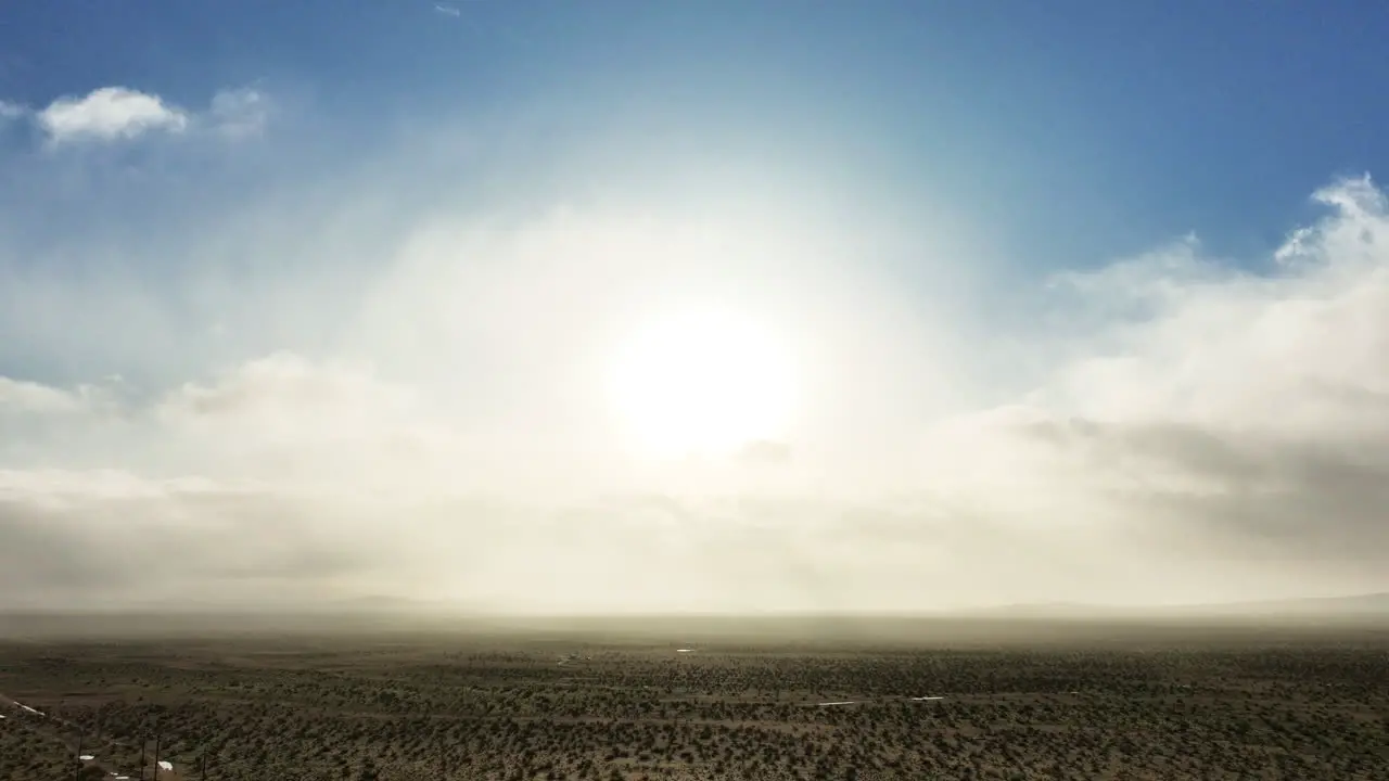 Sun and clouds over the Mojave Desert landscape aerial hyper lapse cloudscape