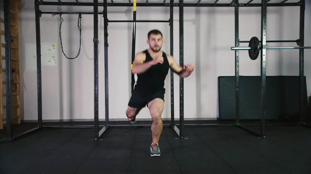 Athlete does exercises in the gym