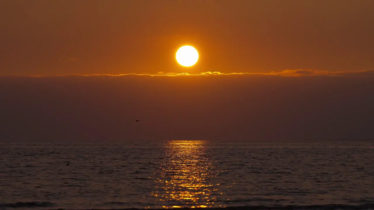 Golden Yellow Orange Sunset Above Clouds And Ocean