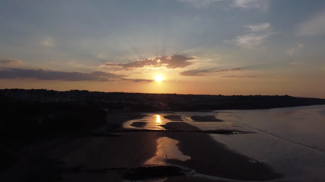 Golden heavenly sunset rays aerial view reflected overlooking romantic exotic beach coastline