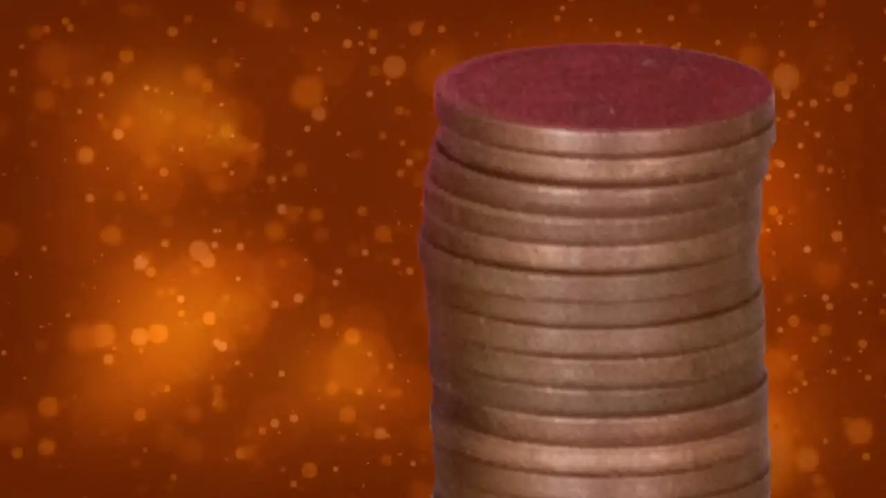 Animation of dots over pile of coins on orange background