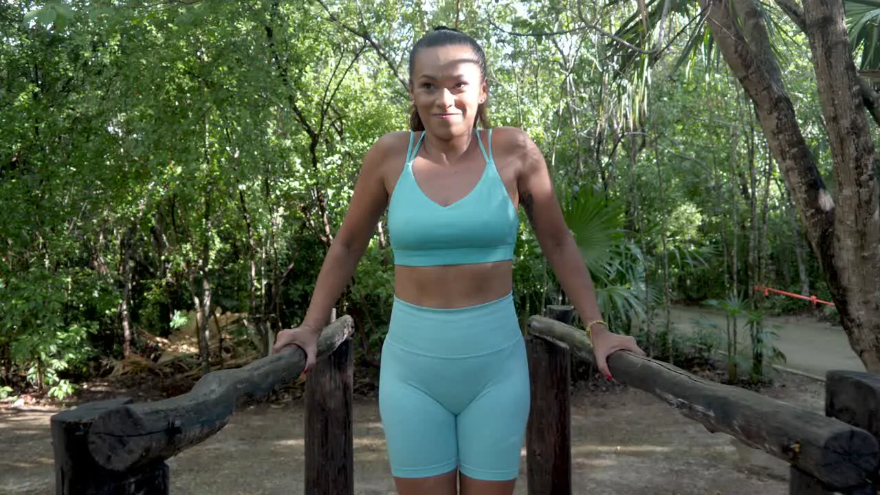 Sexy Latin American Brunette Woman With Tattoos Performing Resistance Exercises In An Outdoor Gym In A Public Park In Mexico At The Time Of COVID-19 Coronavirus Pandemic in 4K Dolly In Shot