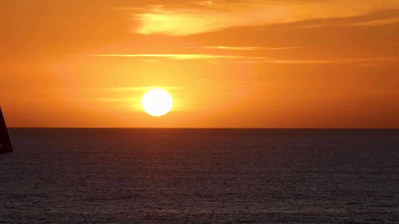 Timelapse of beautiful tropical red sunset at sea in portugal