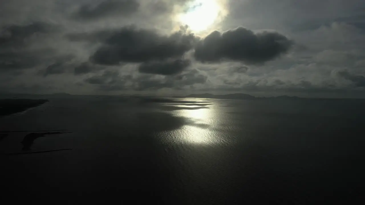 Spectacular morning panning aerial view with interesting light and clouds over the sea in Can Gio Vietnam