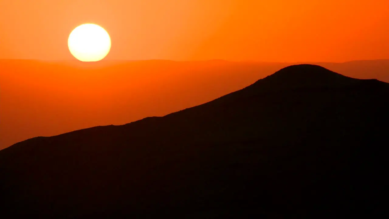 A beautiful generic sunset behind a silhouetted mountain 2