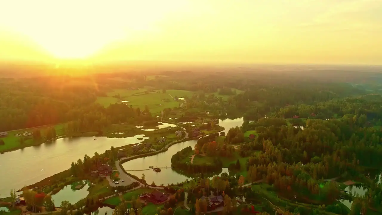 Sunset over landscape with lakes aerial drone view