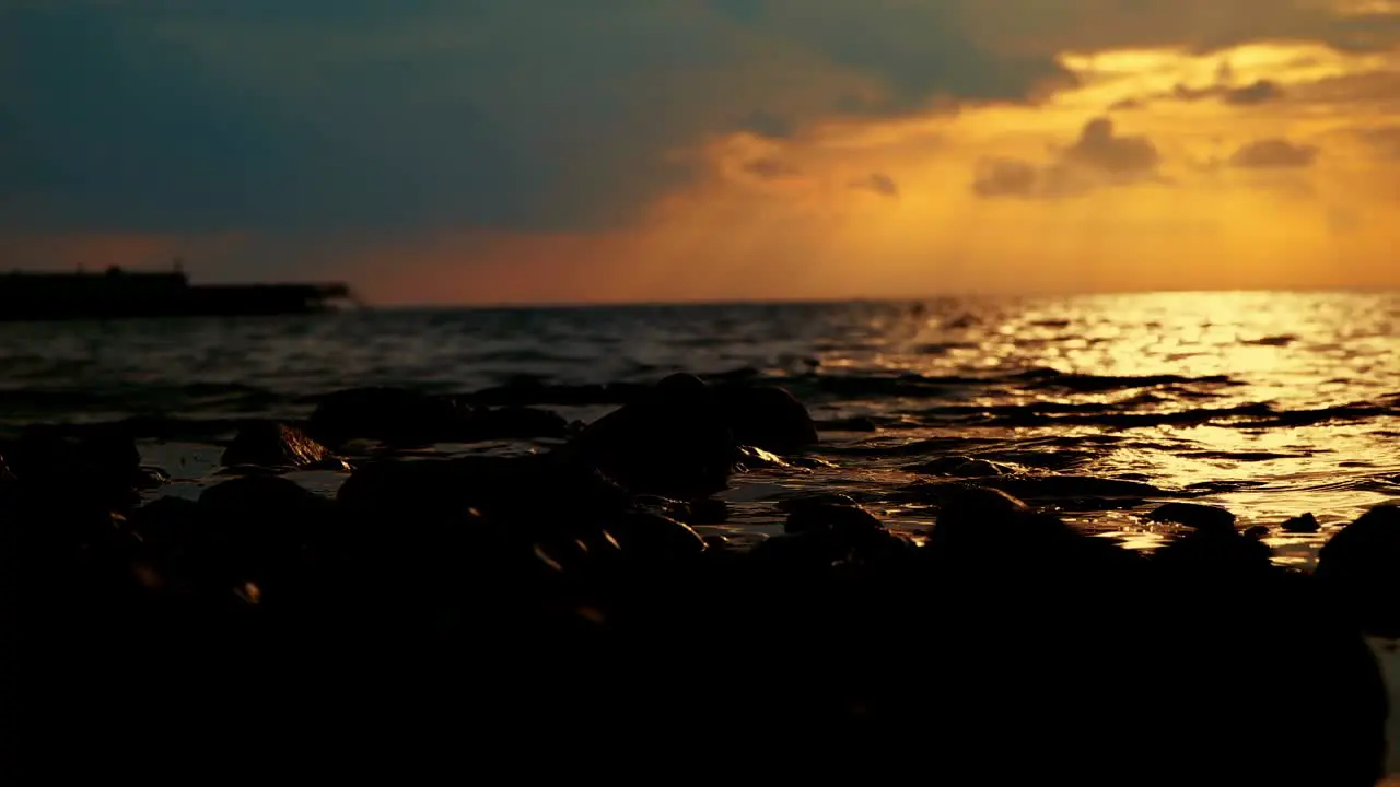 Nature Dark golden color sunset Ocean view waterflow hitting the rocks