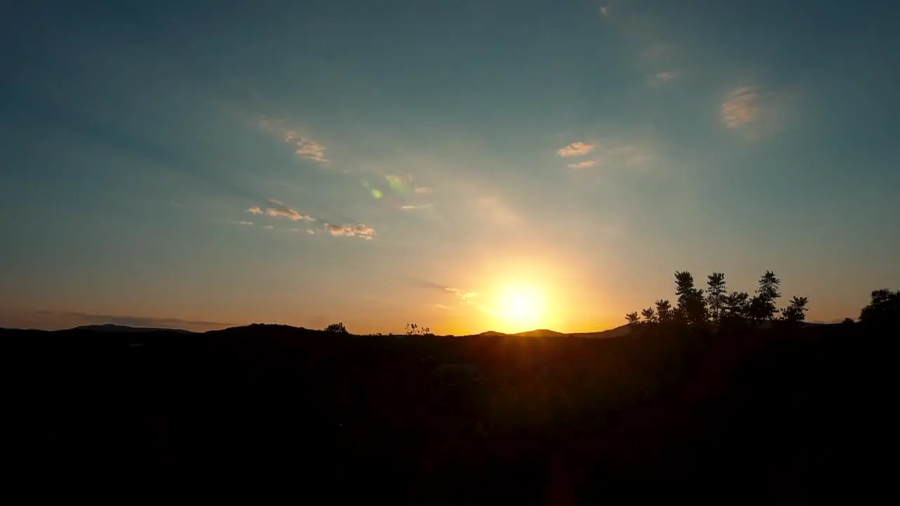 Sunset Clouds Motion Over Mountains Silhouette And Wind Blowing Through Foliage In Wilderness Of Spain