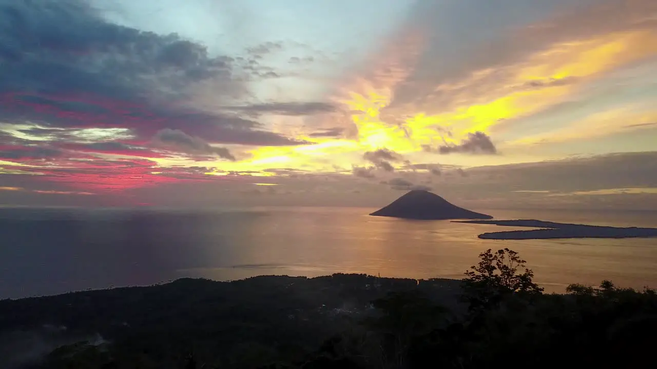 Drone zoom over hiker of Monado Tua Island in Monado Indonesia