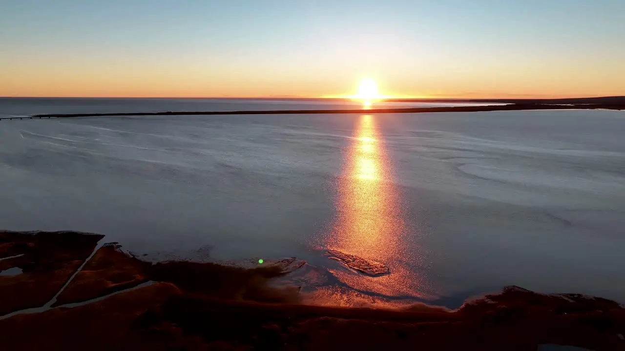 Idyllic Sunset Over Ocean In South Iceland aerial sideways