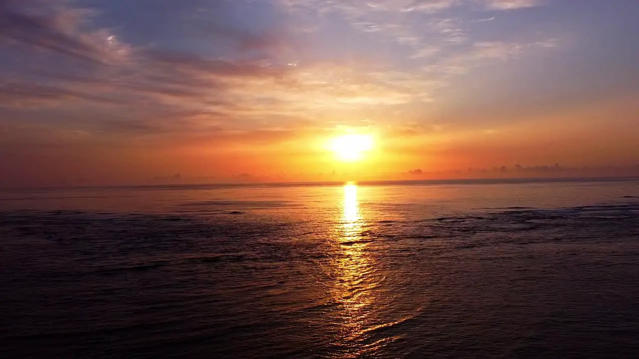 Aerial Drone Shot Flying Over The Ocean Into The Sunset