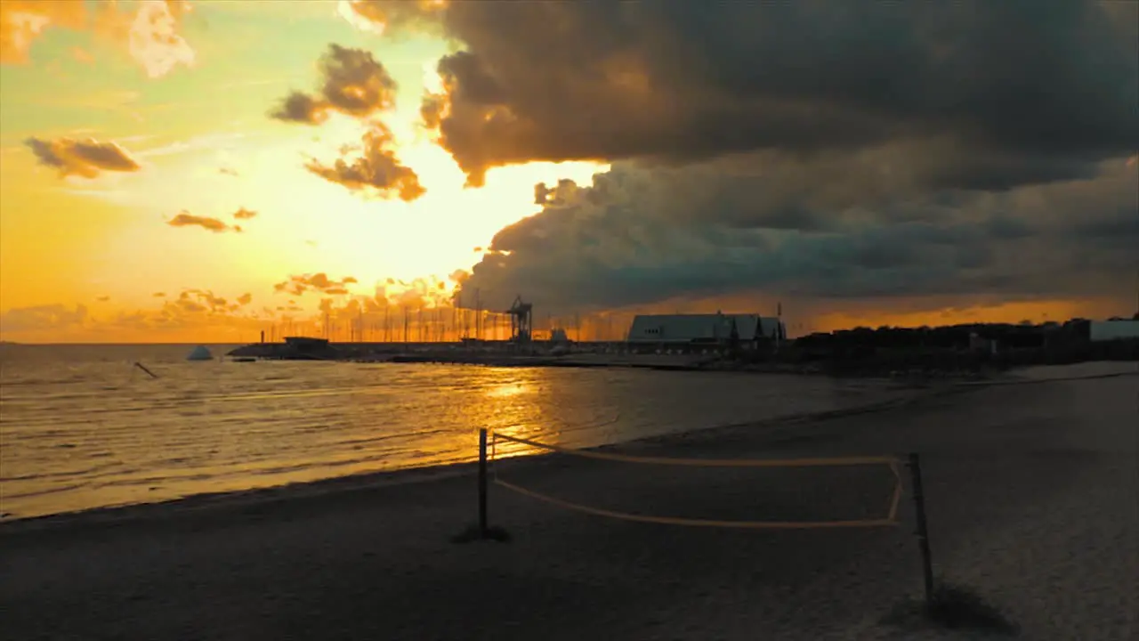 Time-lapse of a sunset over the ocean and a harbor on the coast of Sweden