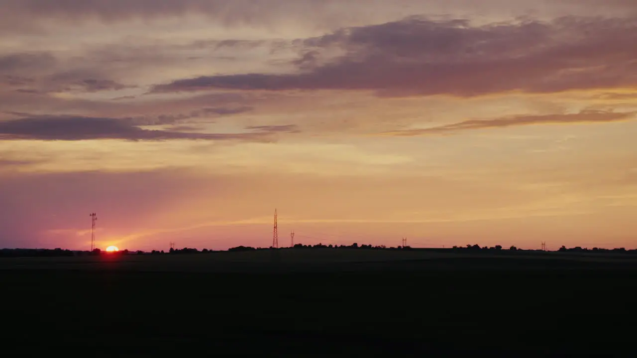 The Disc Of The Setting Sun Over The Field In The Countryside