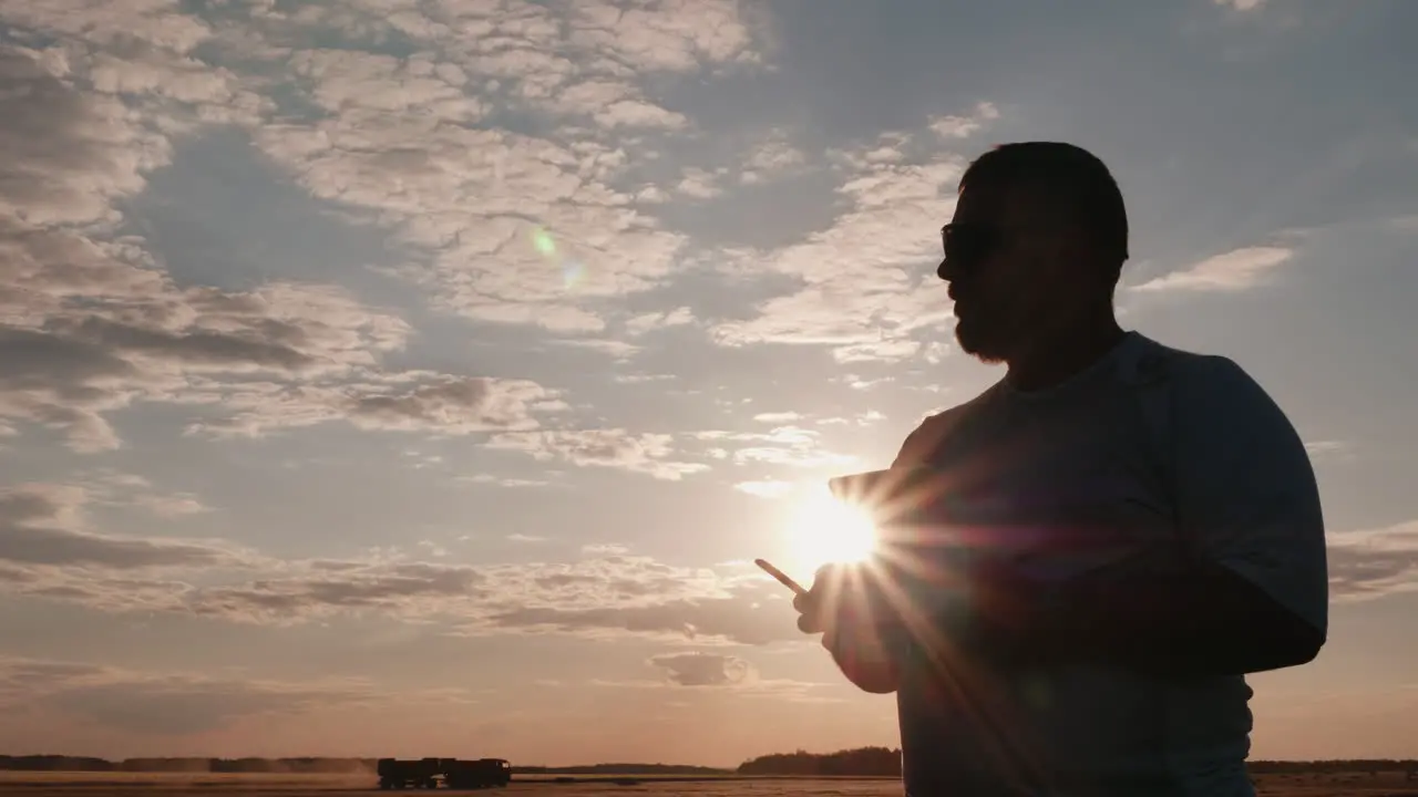 The Man Controls The Drone While The Camera Follows It