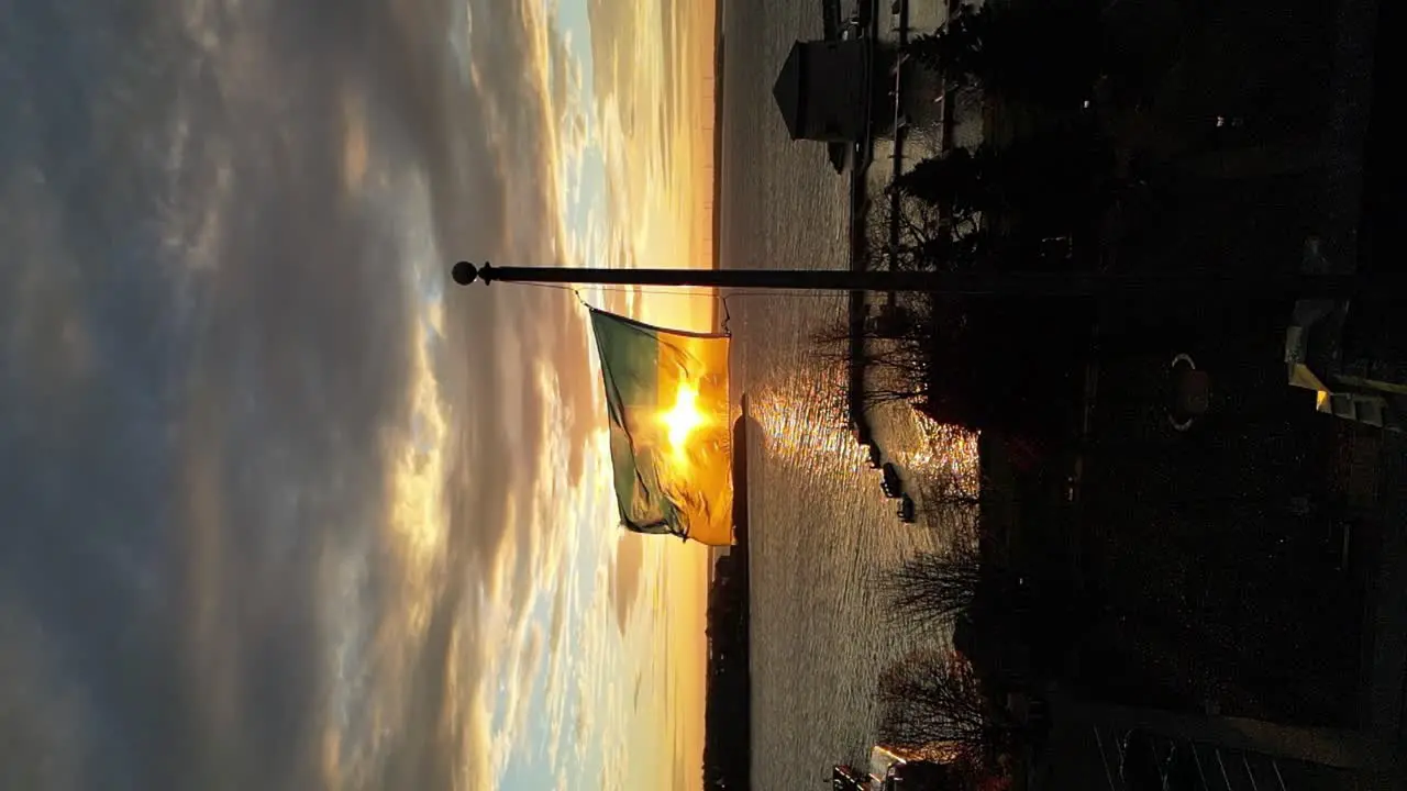 Ukraine Flag in slow motion during a Sunrise on a flag pole vertical video