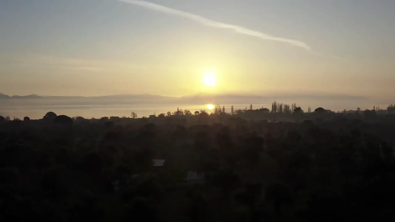 Silhouette of Lesbos island and sun reflection in sea during sunset