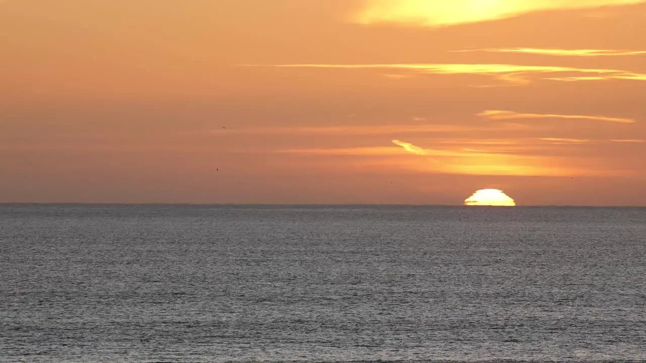 Time lapse of the sun setting over the ocean in Cascais