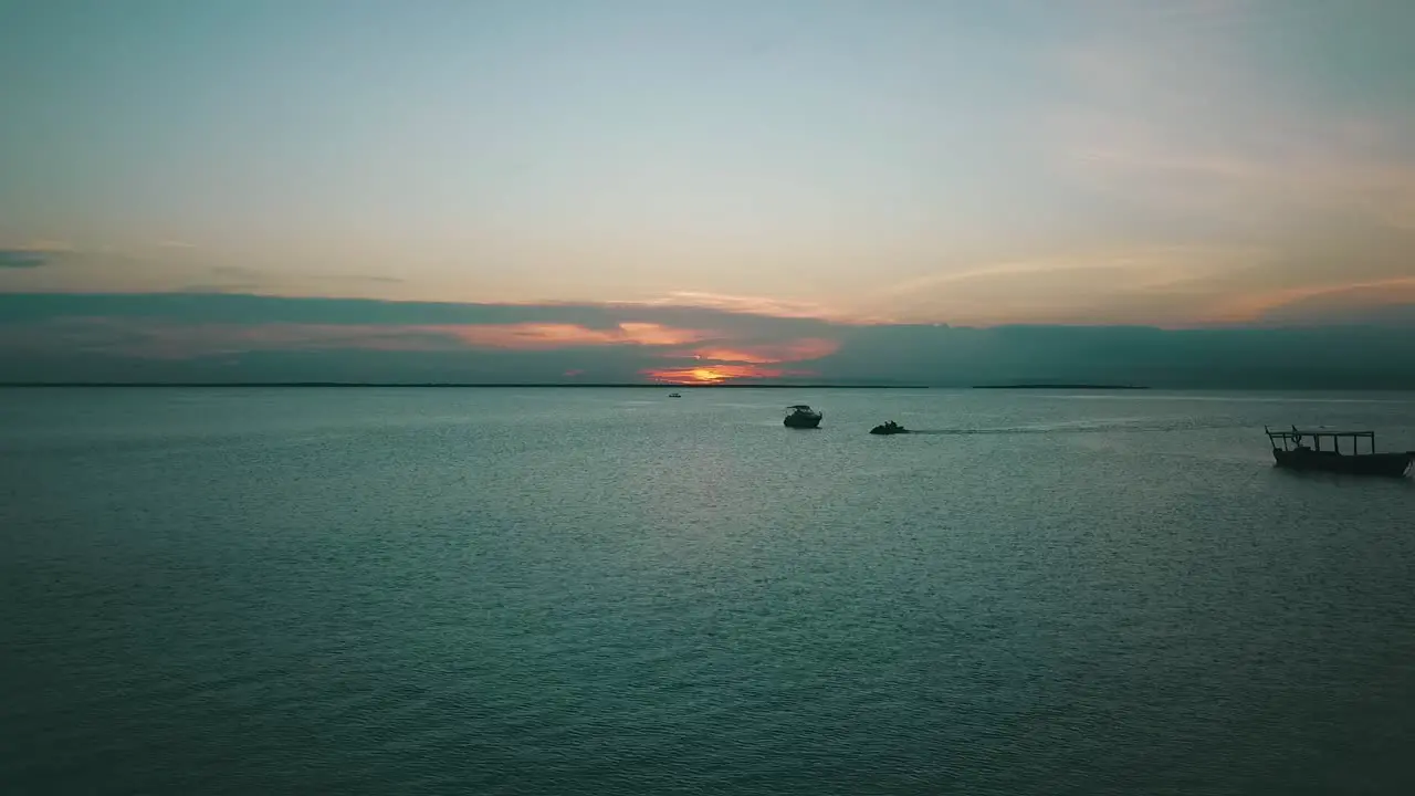 Unbelievable aerial flight slowly rise up high drone shot at nice sunset over coast line boats in paradise dream beach Zanzibar Africa Tanzania 2019 Cinematic wild nature 1080 60p by Philipp Marnitz