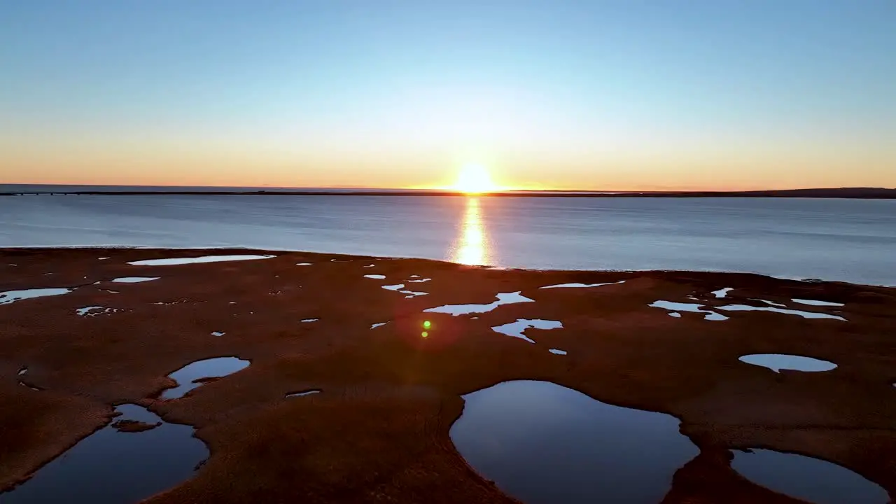 Scenic Sunset In The Ocean In Eyrarbakki Iceland aerial drone shot