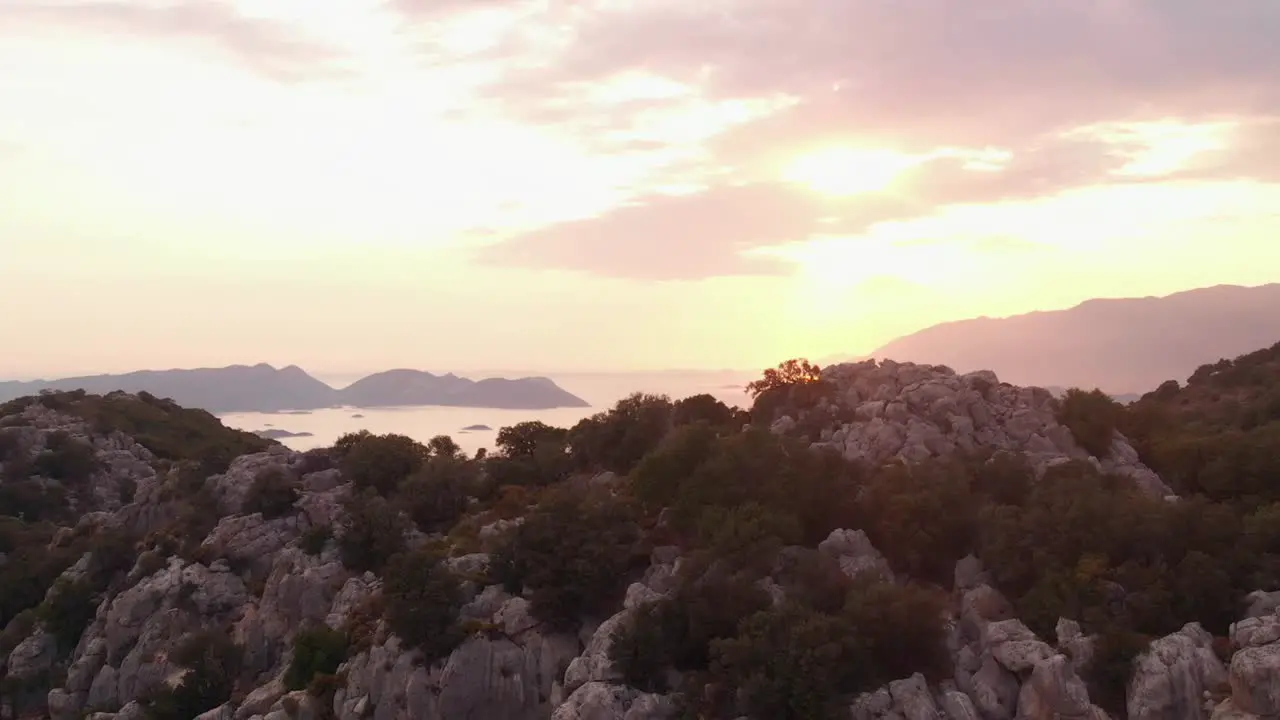 Beautiful fiery sunset over the rocky mountain shoreline of Turkey -aerial