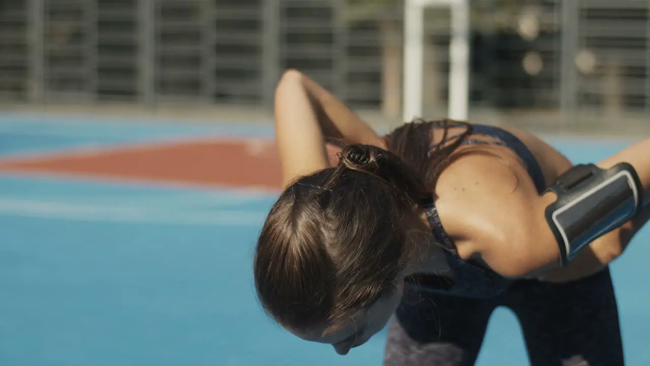 Sporty Girl Resting To Take Breath And Then Keeping Running At Sport Court On A Summer Day 1