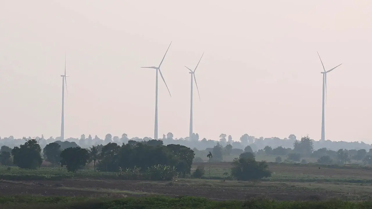 Wind Turbines producing sustainable energy in the rural areas of Thailand to supply power to factories and industrial plants