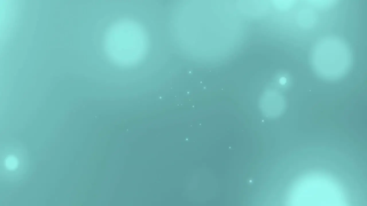 Animation of light spots floating on green background