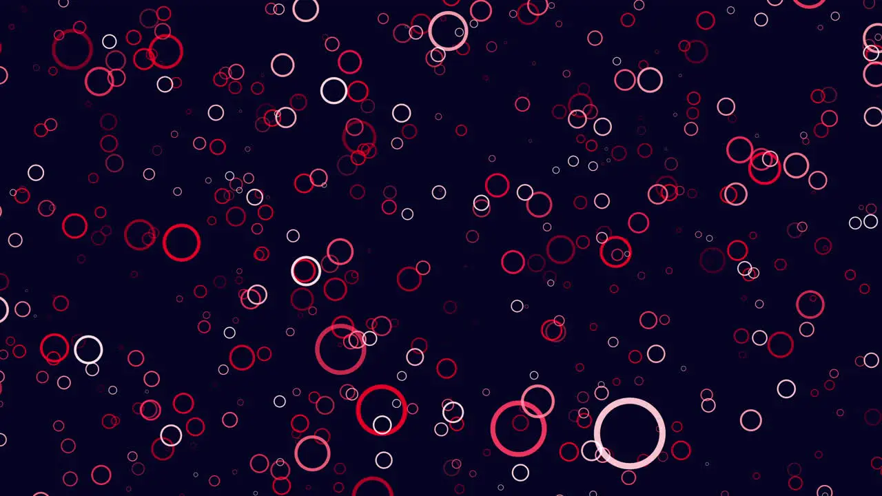 Circular red circles floating on black background abstract pattern