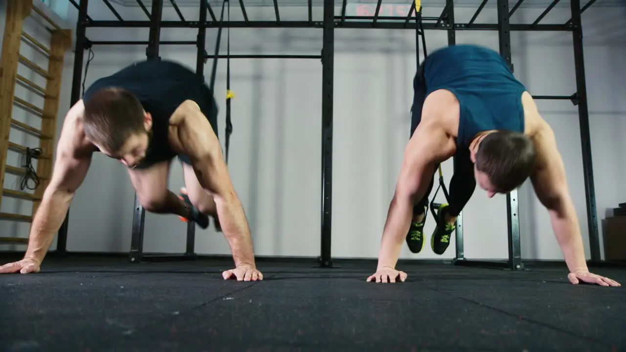 Two athletes do strength exercises in the gym 1