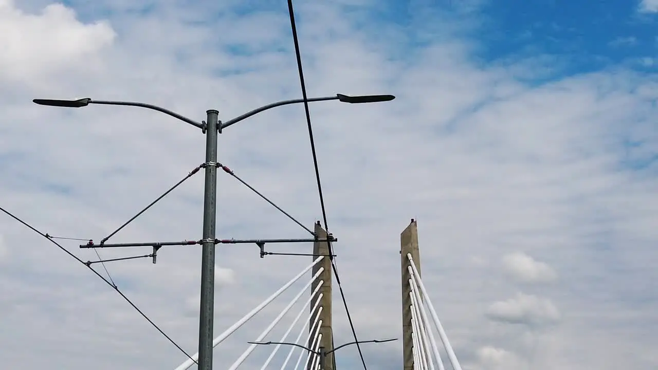 HD Looking up going across Tilikum Crossing Bridge in Portland Oregon with mostly cloudy sky take six