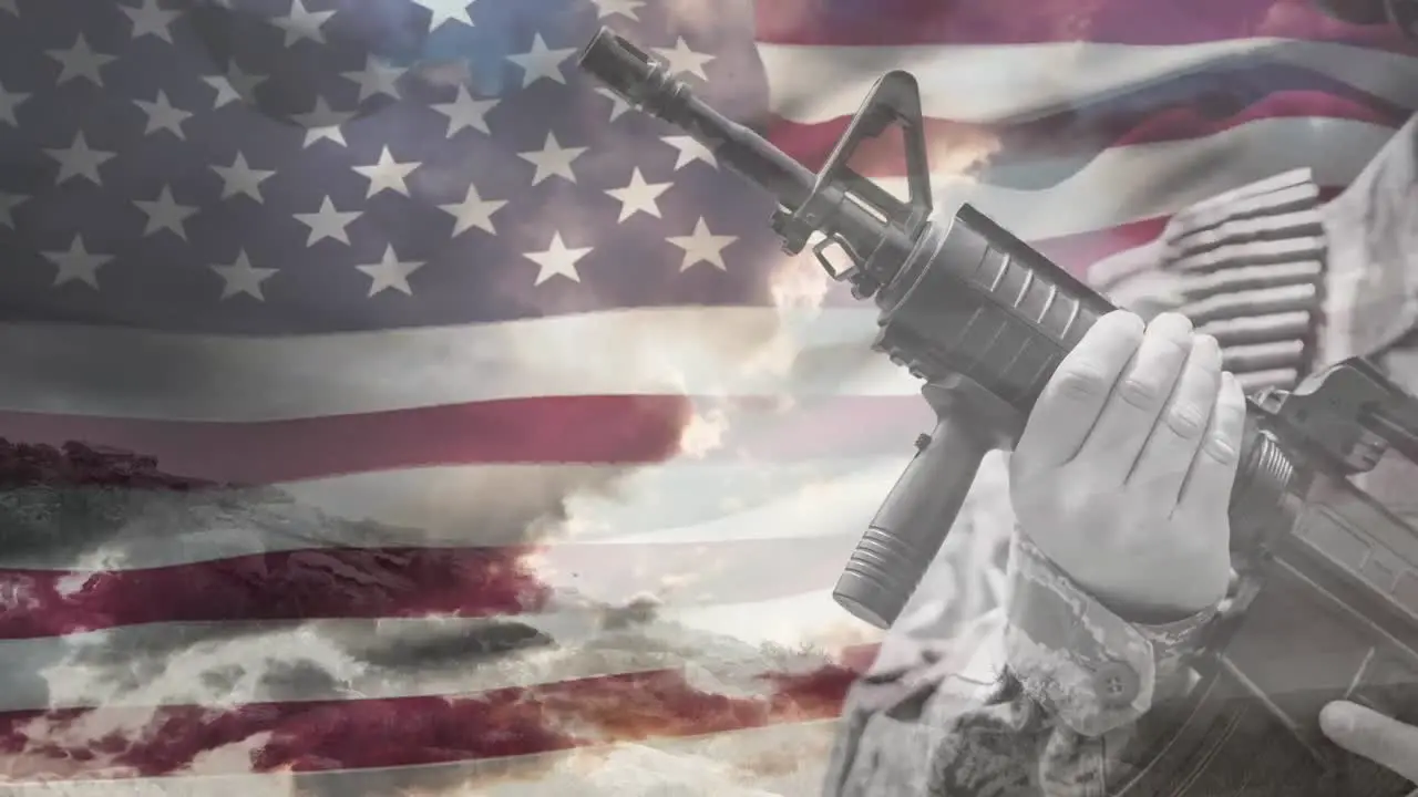 Animation of hand of soldier holding gun over waving american flag and cloudy sky