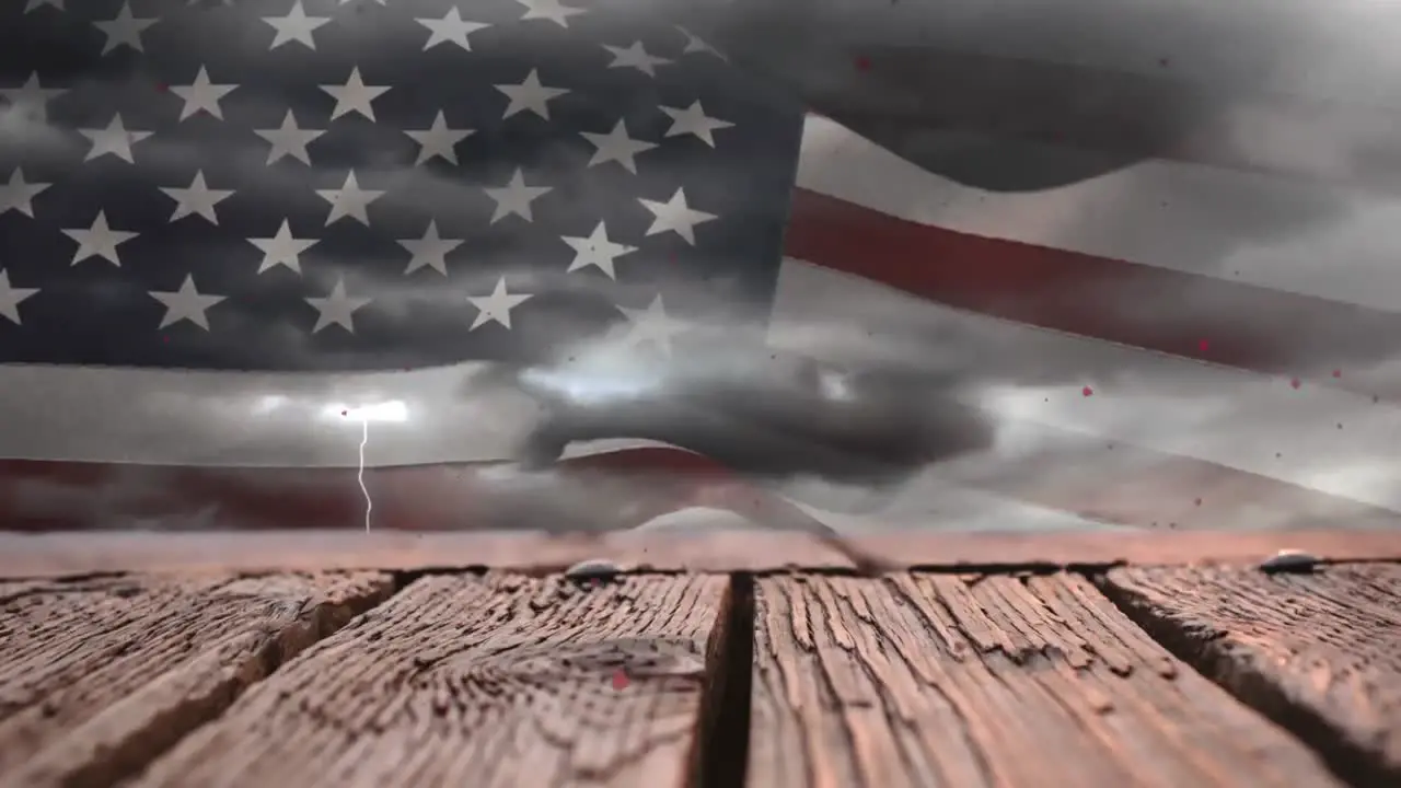 Animation of heart shapes falling over wooden planks against flag of america on cloudy sky