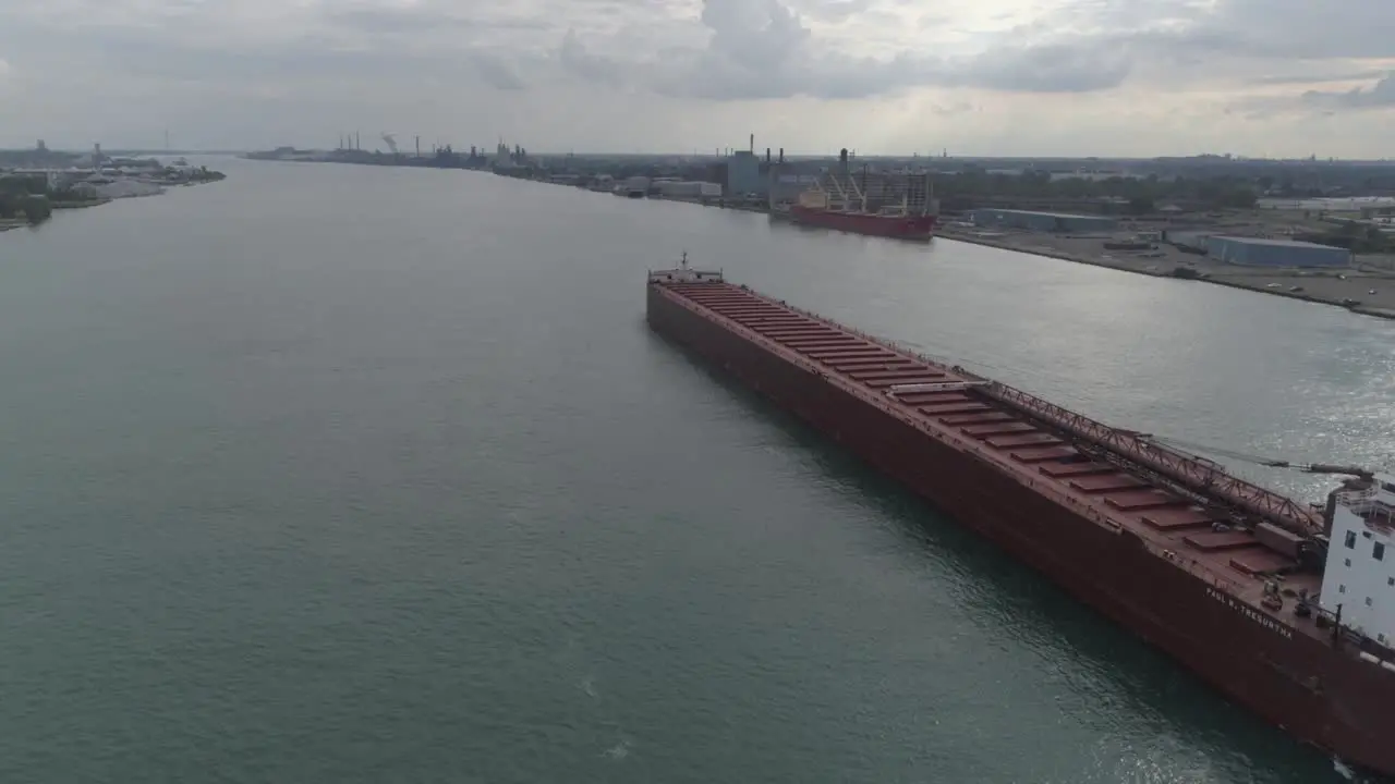 This video is of an aerial of large tanker ships in the Detroit river near downtown Detroit