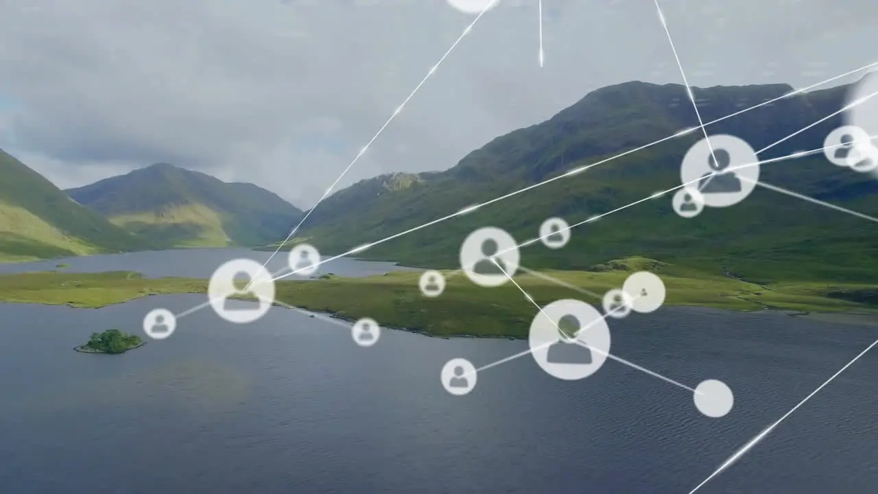 Animation of connected icons over aerial view of lake between mountains against cloudy sky