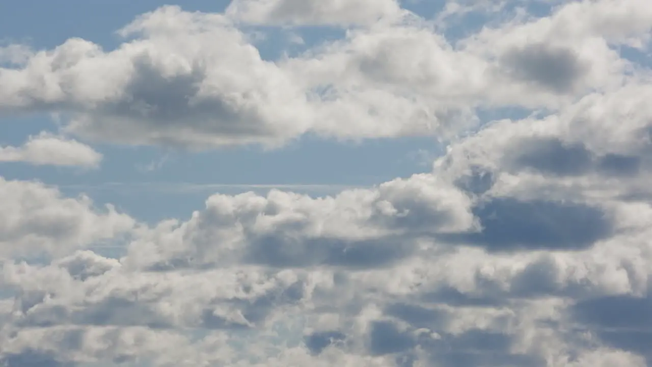 Stunning timelapse of white clouds on a bright blue sky during day cloudscape