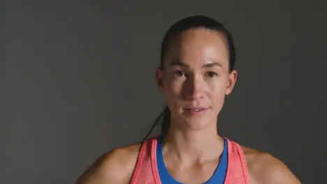 Tracking Shot of Young Woman Walking Towards the Camera Smiling