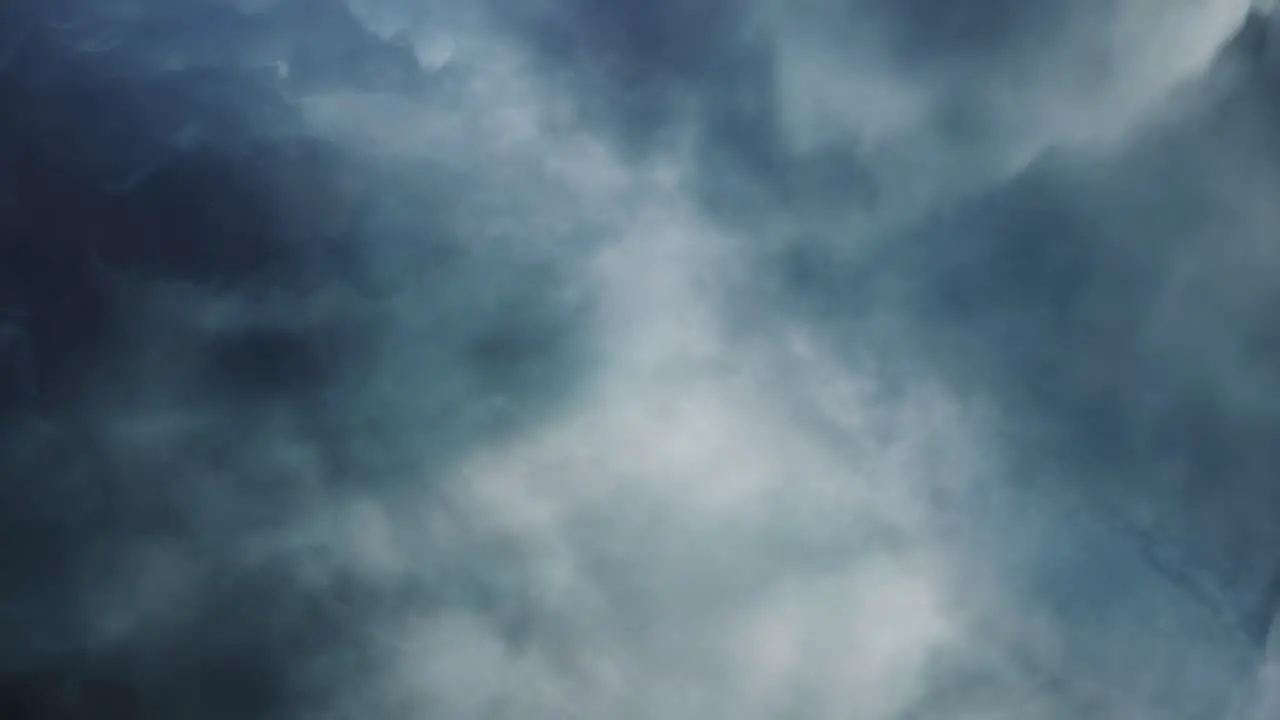 4k thunderstorm breaking through the dark thick clouds in the sky