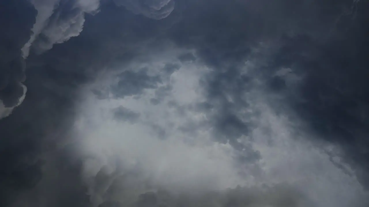 4k thunderstorm lightning strike behind dark clouds