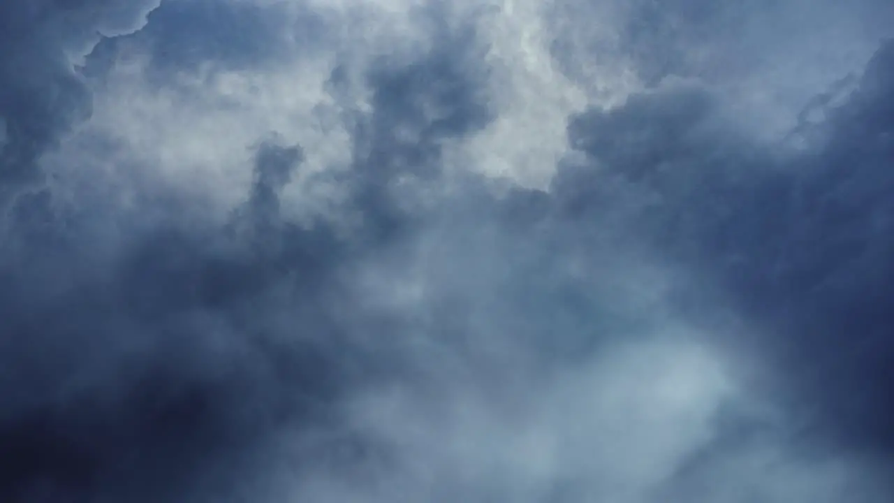 4k thunderstorm POV of lightning strike behind thick clouds